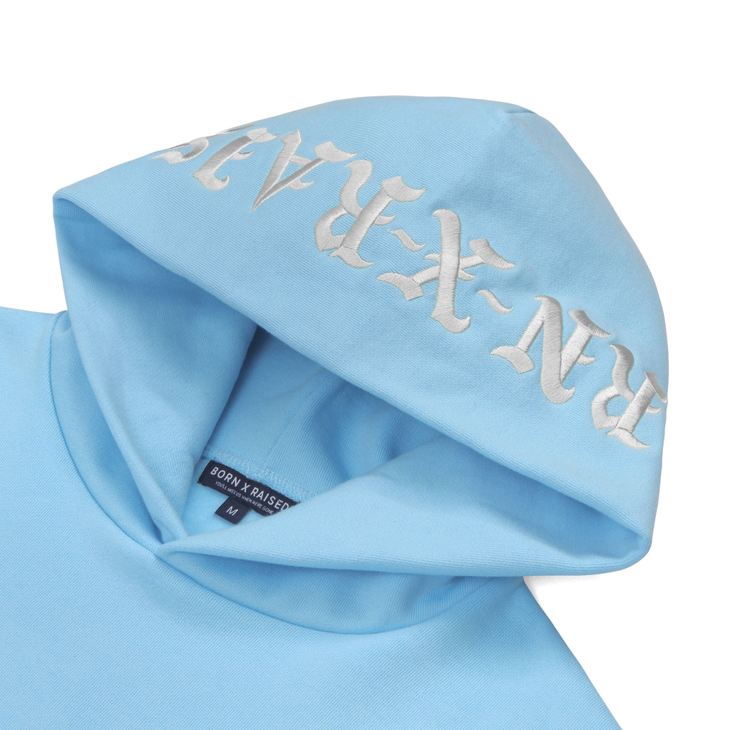 Born and Raised Valentines Day Collection "Too Many Tears" - Embroidered BornXRaised hood and Chest logo on baby blue sweatshirt.